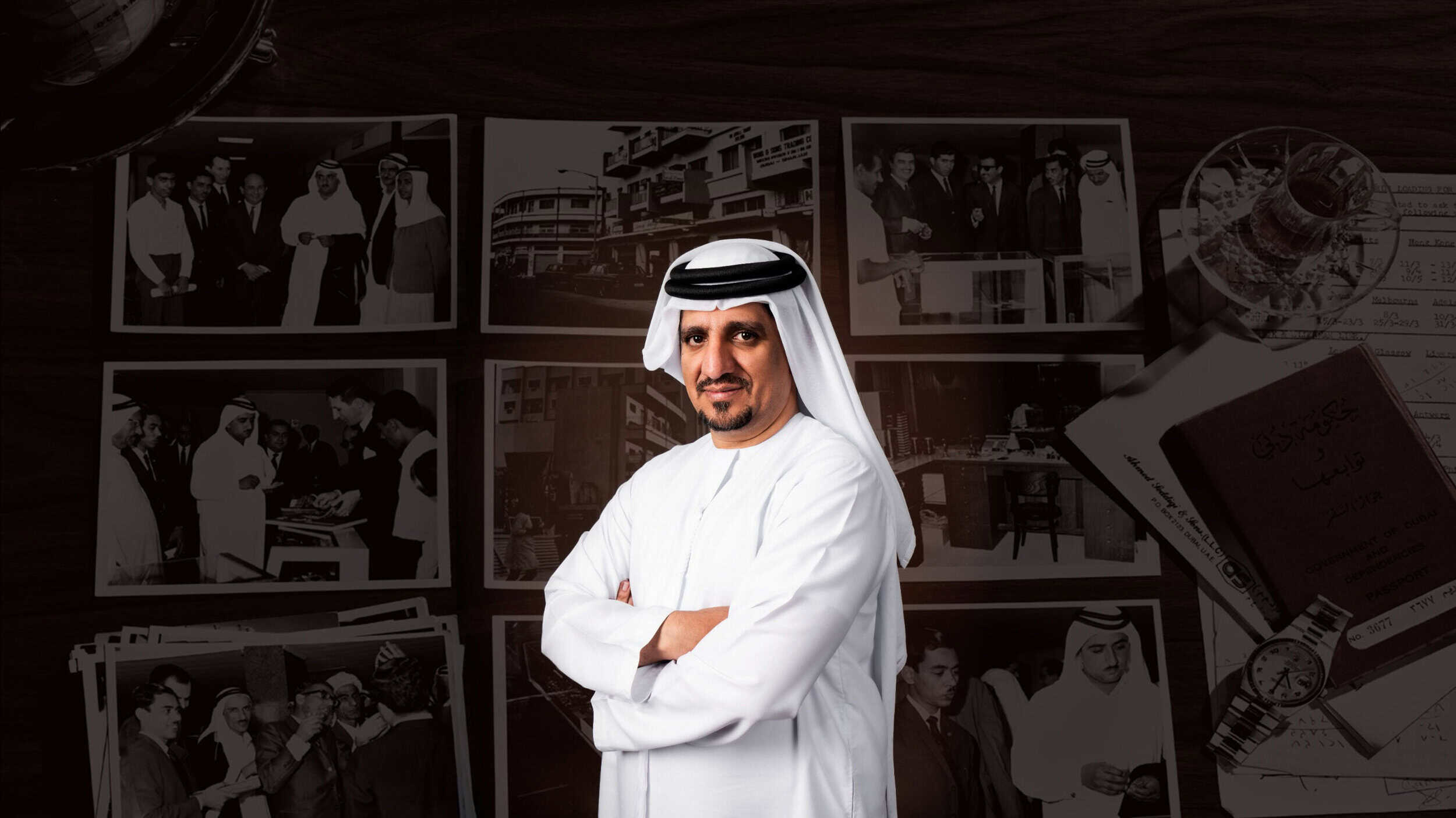 Elegant Emirati man in traditional attire standing confidently in front of Bovet branding and histor.