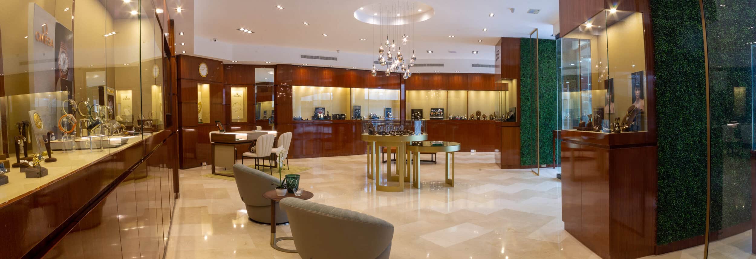 Elegant interior of AG Joyería showcasing luxurious display cases with exquisite timepieces and jewe.