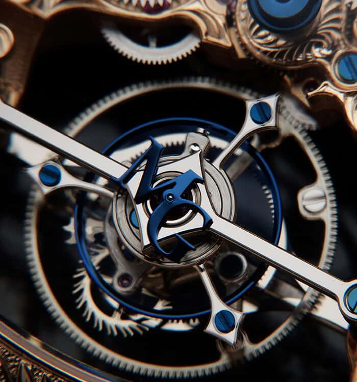 Intricate Bovet timepiece with visible mechanical movement and blue accents, showcasing craftsmanshi.