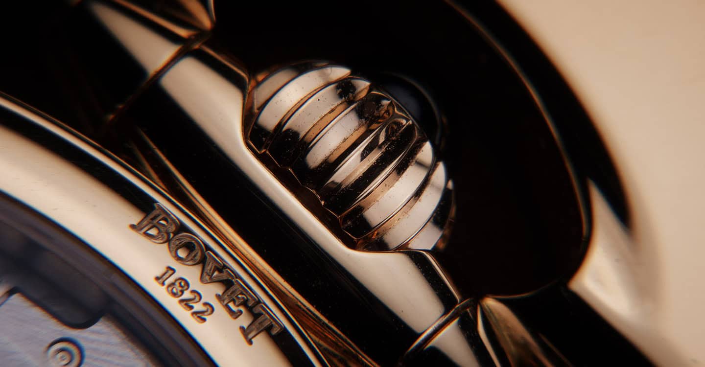 Close-up of a Bovet timepiece crown with intricate detailing and polished finish.