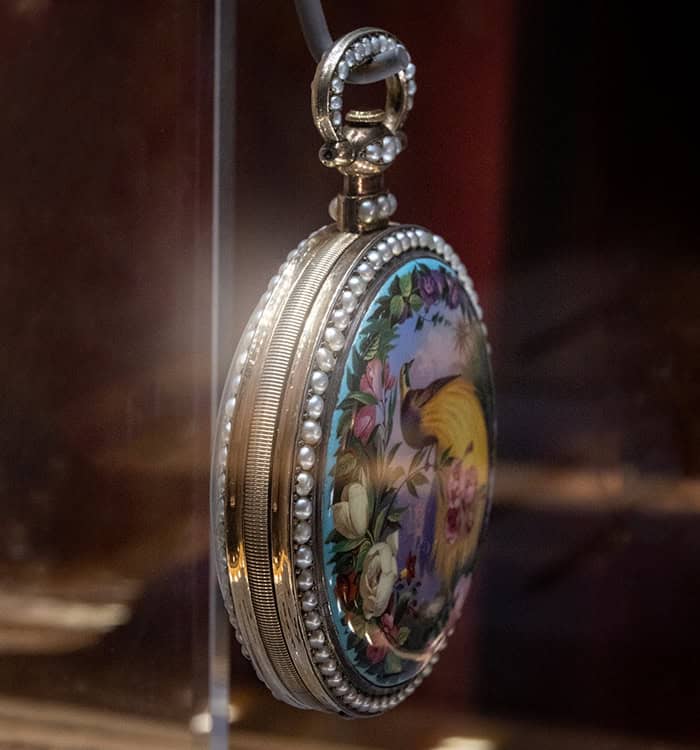 Ornate vintage timepiece with floral enamel design and pearl accents, from Bovet's historical collec.