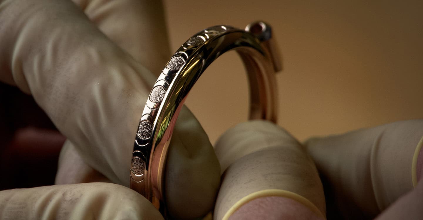 Luxurious bespoke timepiece with intricate metalwork and elegant design details.