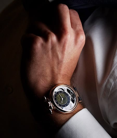 Luxurious Orbis Mundi timepiece with intricate dial design and gold accents.